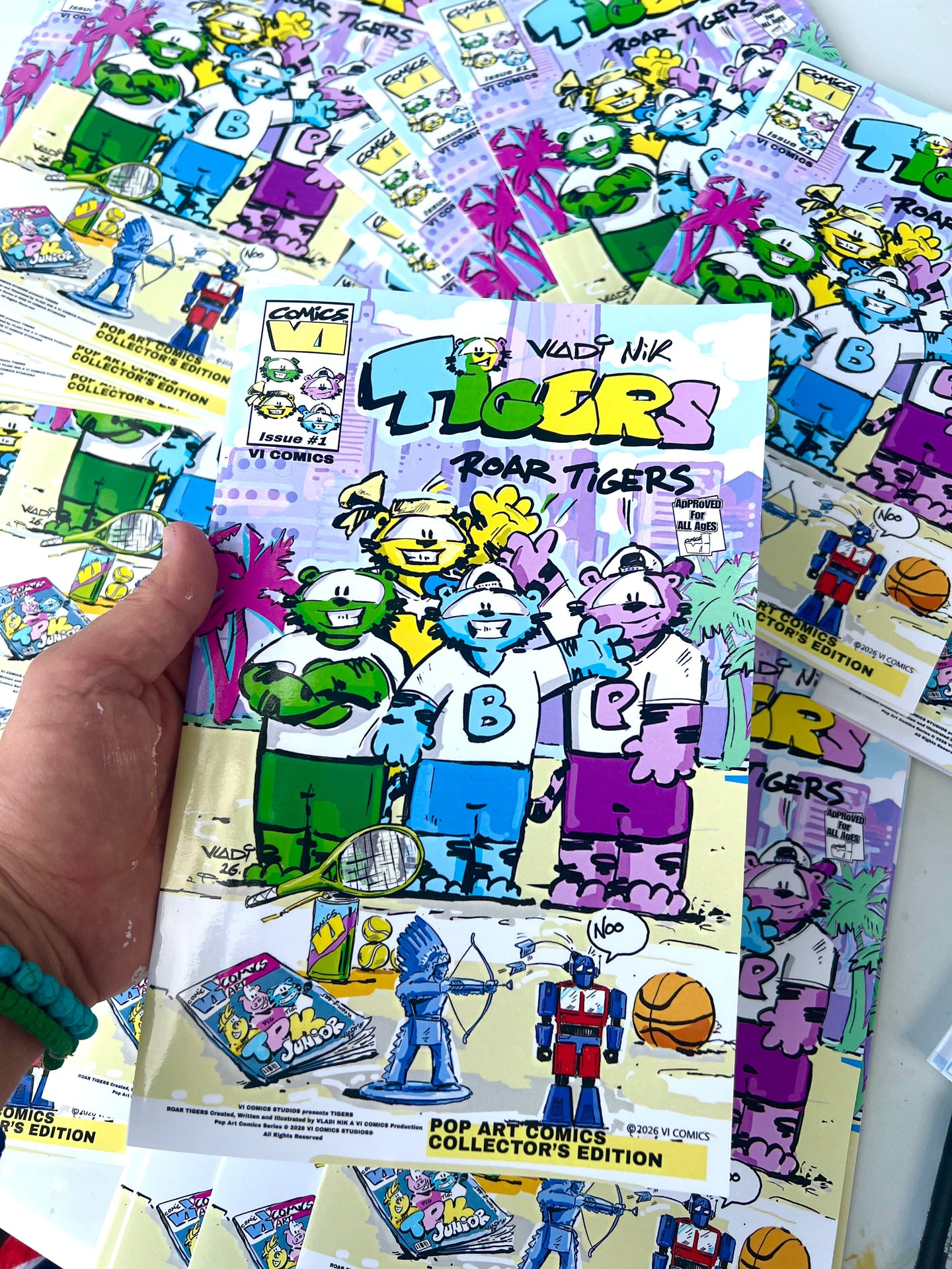Vladimir Nikolov , Art VLADI, Vladi Nik , holding the cover of the TIGERS Issue #1 comic from the VI COMICS universe.