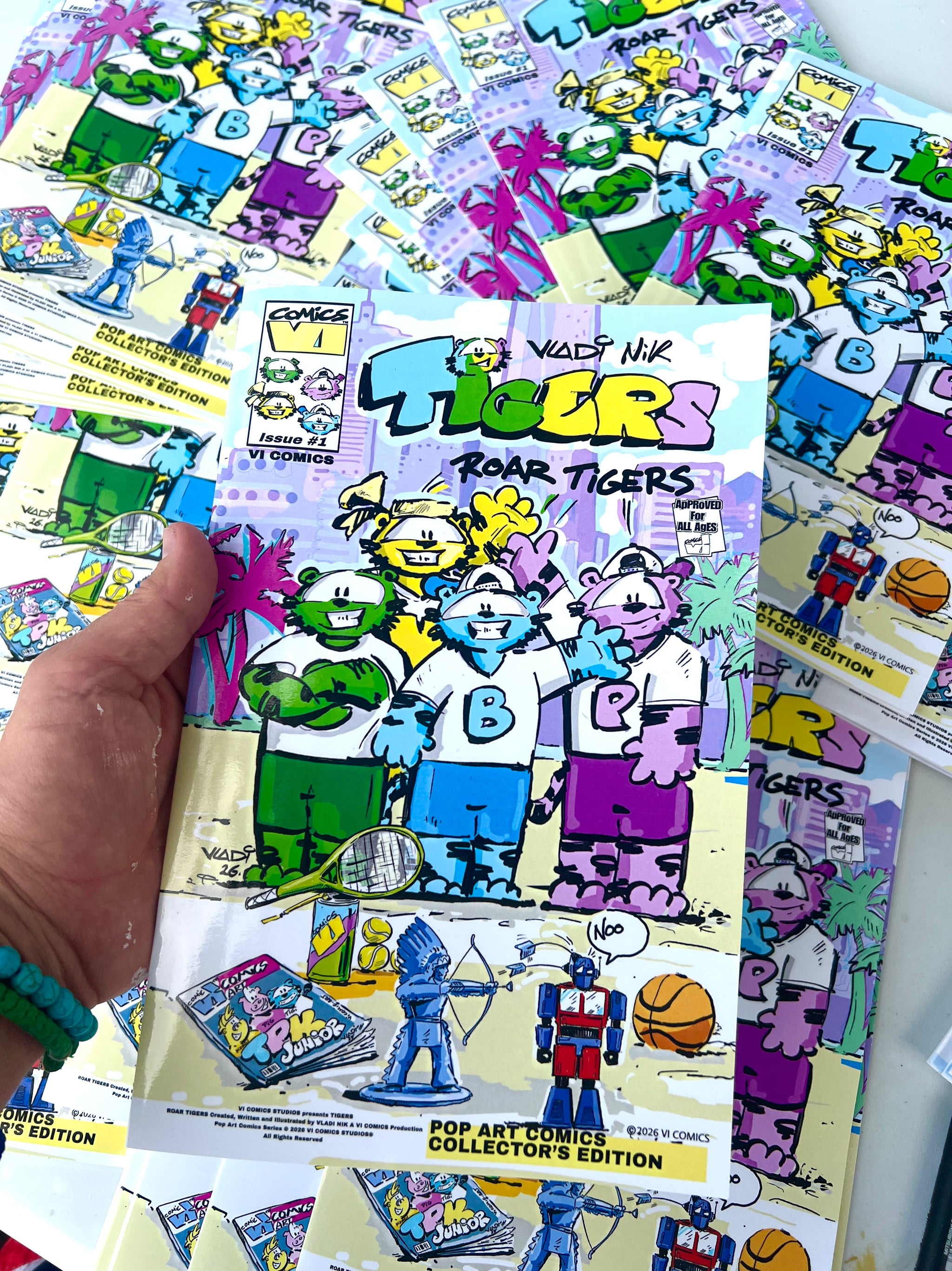 Vladimir Nikolov , Art VLADI, Vladi Nik , holding the cover of the TIGERS Issue #1 comic from the VI COMICS universe.